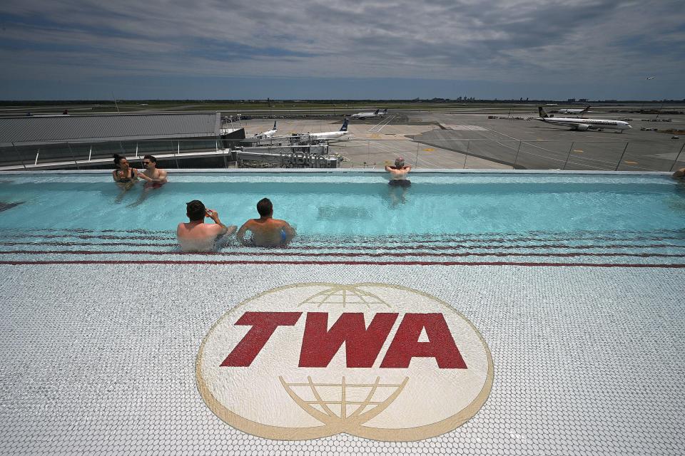 The hotel also has an infinity pool where people can watch the planes