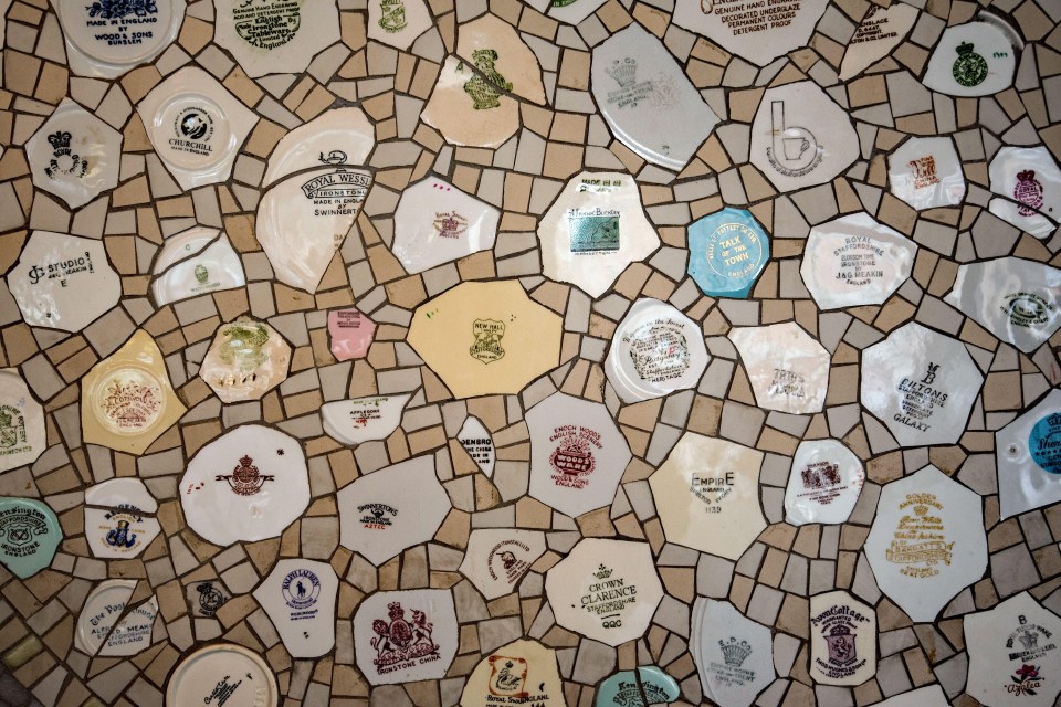 In the foyer of The Potteries Museum & Art Gallery is a wall of pottery pieces showing markers marks