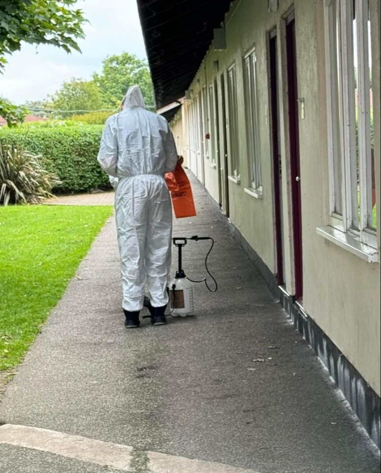 Photos of staff cleaning rooms in hazmat suits were shared on social media