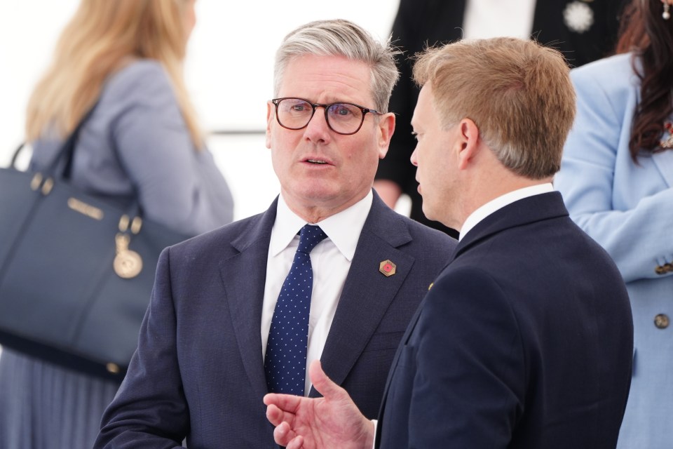 Labour leader Sir Keir Starmer speaking with Defence Secretary Grant Shapps