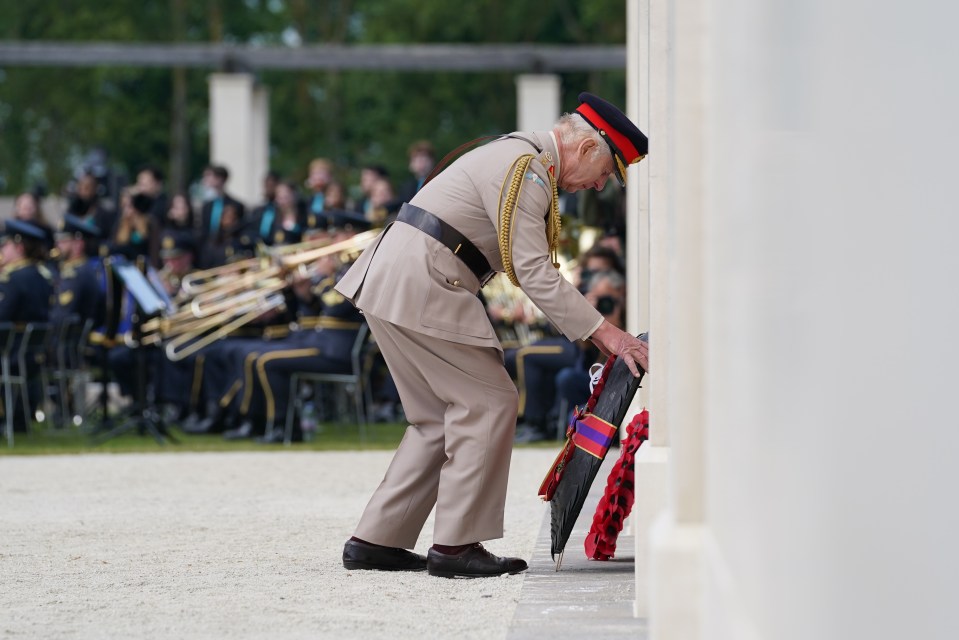 King Charles lays a wreath