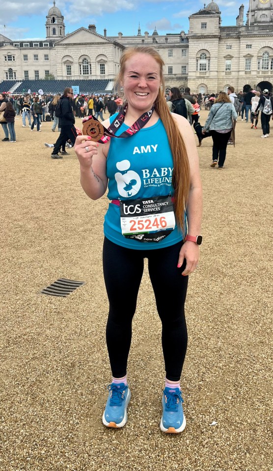 Amy pictured after running the 2024 London Marathon