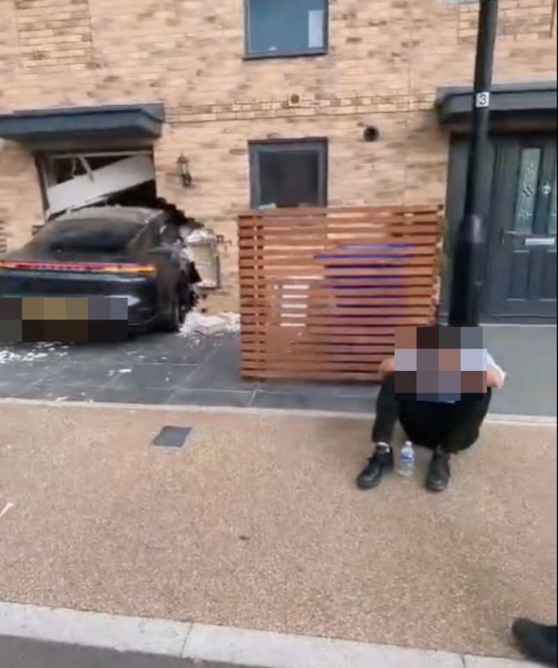 A young man was seen sitting on the pavement near the crash site