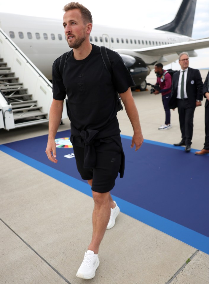 England captain Harry Kane emerged as the squad touched down in Germany