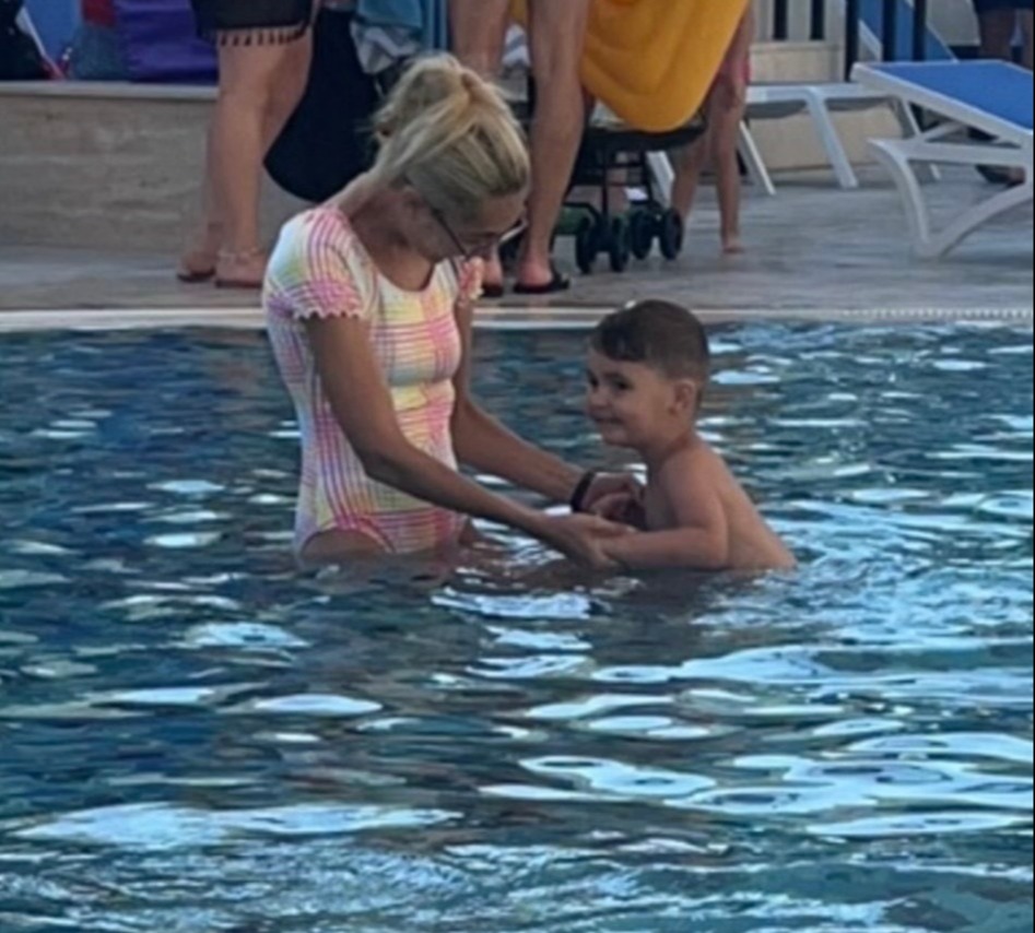 Holly in the swimming pool at the hotel with her son Kaidan