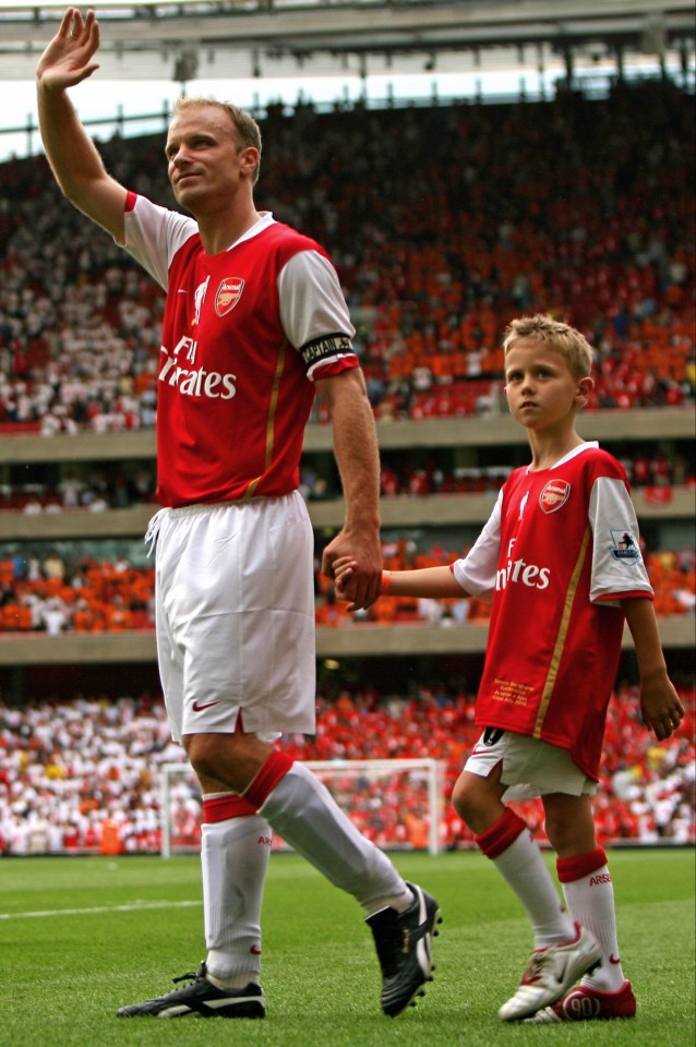 Mitchel, right, on the Emirates pitch with dad Dennis Bergkamp after the Gunners legend's farewell testimonial