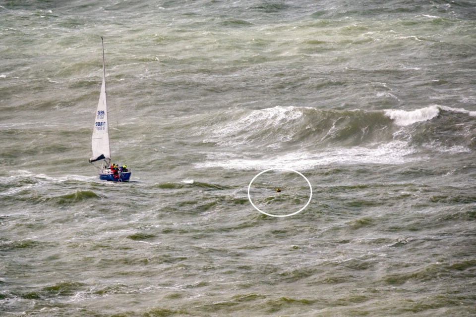 BNPS.co.uk (01202 558833) Pic: JamieRussell/IslandVisions/BNPS Weather input. Pictured: Man overboard! A person was seen floating with their lifejacket. Extreme conditions saw many sailors pull out of an annual yacht race on Saturday with some even capsizing and a crash. The Round the Island Race - a 50-mile circumnavigation of the Isle of Wight - normally attracts one of the largest fleets of any yacht race. But this year the competition faced some of the most severe conditions in years with gusts of over 50 knots recorded at The Needles, the most eastern point of the course. Race organisers cancelled eight classes before the race started. The conditions put off many from entering and many more retired early. After eight hours of racing just 61 boats had completed the course.