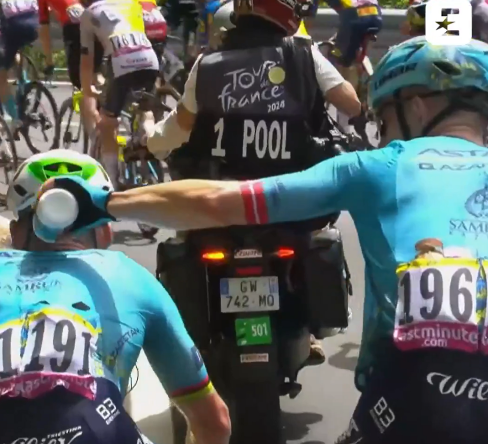 Cavendish's teammates were trying to cool him down with water