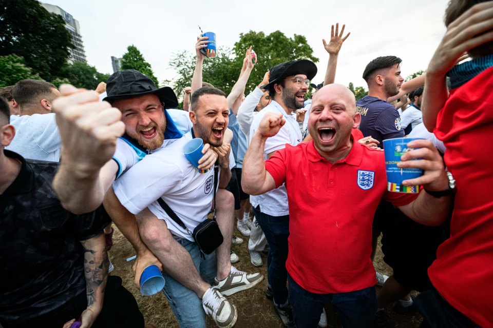 England fans celebrate at the official UEFA Fan Zone during England's win over Serbia