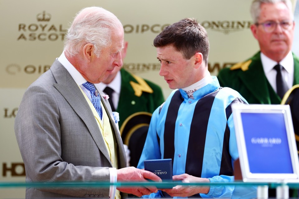 ASCOT, ENGLAND - JUNE 18: King Charles III chats with jockey Oisin Murphy after he won the King Charles III Stakes during Royal Ascot 2024 at Ascot Racecourse on June 18, 2024 in Ascot, England. (Photo by Bryn Lennon/Getty Images)