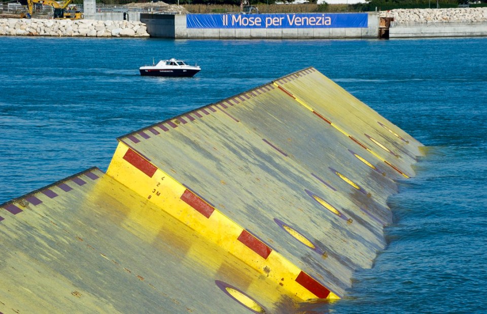 Three of the MOSE flood barrier gates were lifted for the first time during a press conference in 2013