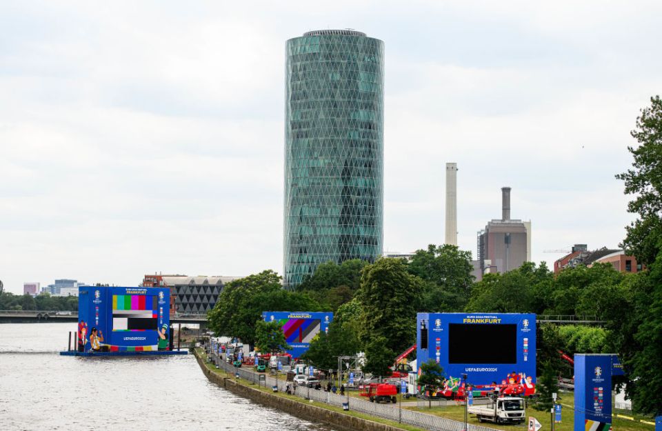 The Frankfurt fan zone has a giant TV screen floating on the River Main