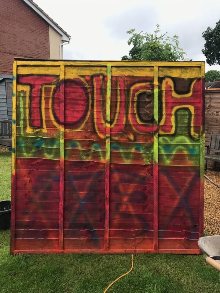 Business owner Sally graffitied the four fence panels in her garden