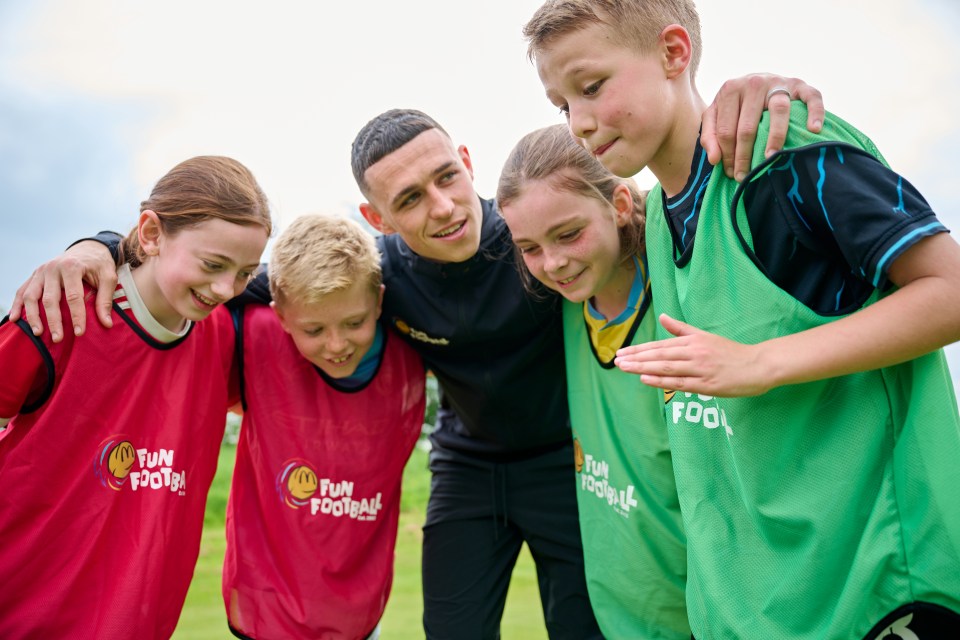 McDonald's Fun Football programme gave 1.7million hours of free coaching to 284,000 children last year, pictured Phil Foden at a kickabout with young players