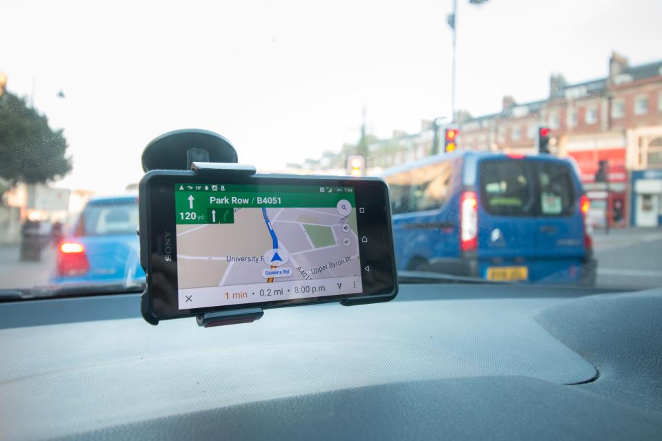 The phone should be mounted to the windscreen or dashboard