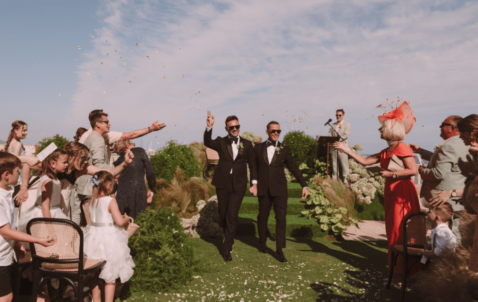 The happy couple were showered in confetti by the wedding party