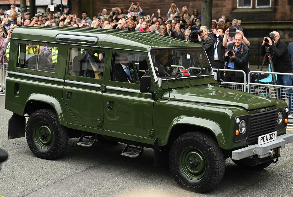 Crowds waved as Hugh arrived