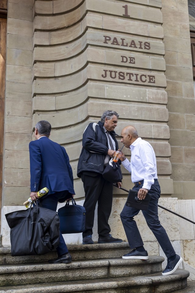 Ajay Hinduja (R) arrives for the resumption day of the trial, June 10