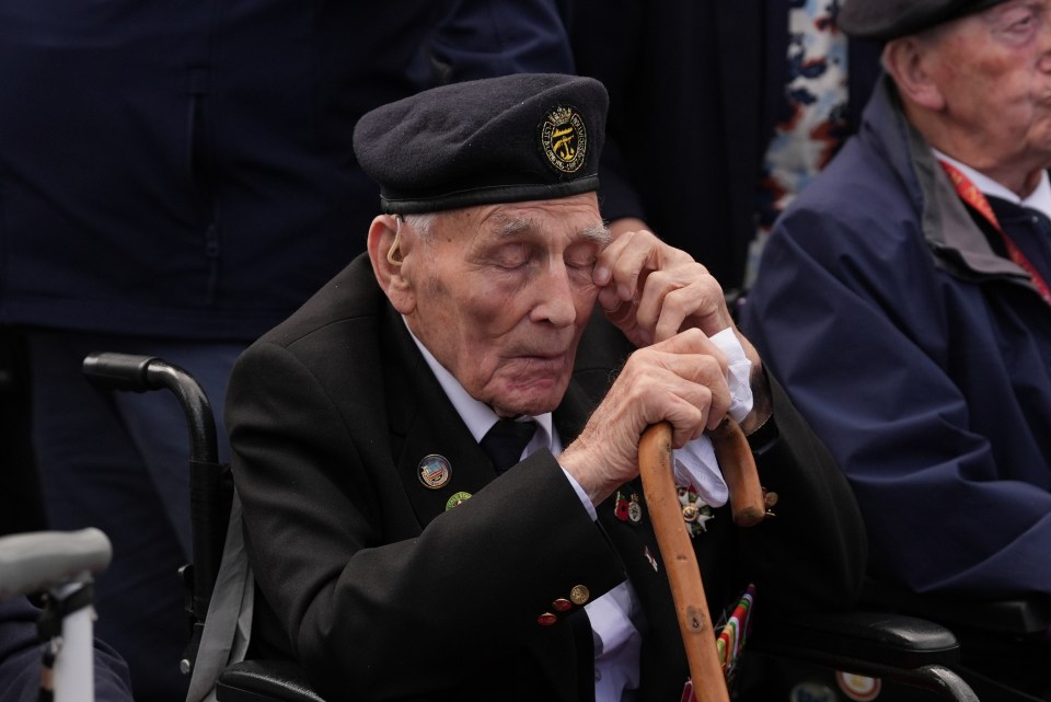 D-Day veteran John Dennett, 99, wipes his eye at the statue of Field Marshal Montgomery in Normandy