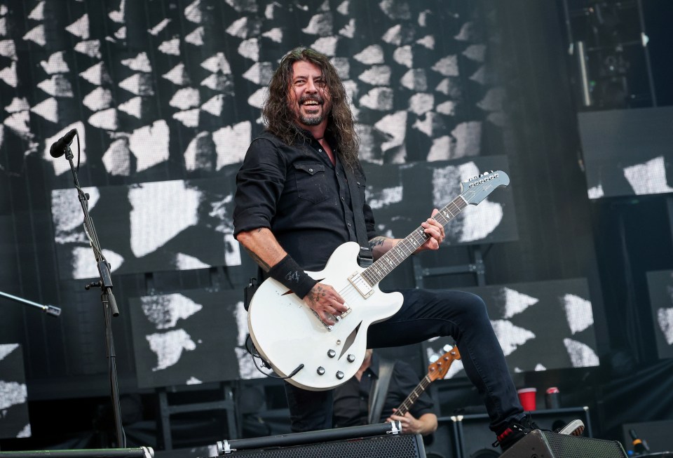 Dave Grohl leads the band onstage in the London Olympic stadium last night