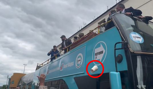 The coffee cup was snapped being launched at the bus