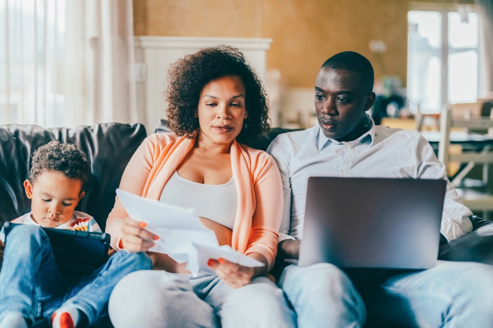 Family at home analyzing bills