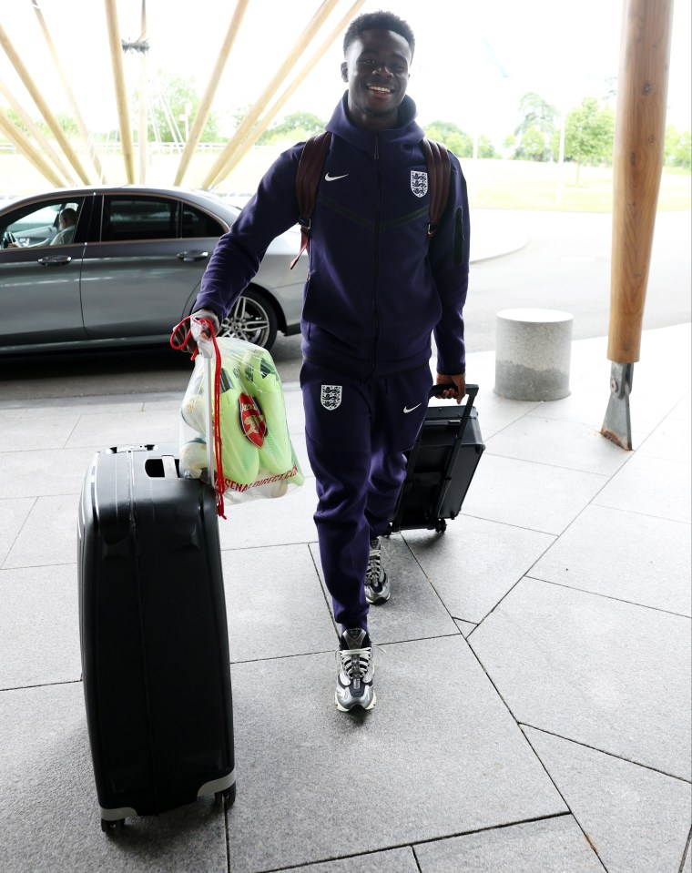 Saka was all smiles as he linked up with the squad yesterday