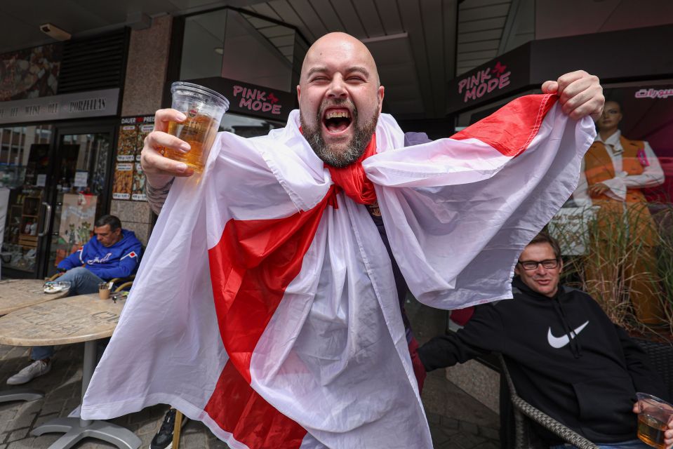 English fans draped in flags downed pints in Gelsenkirchen ahead of the Serbia clash