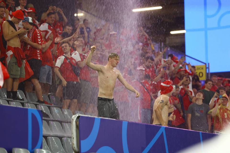 Fans took cover in the concourses - but some braved the adverse conditions