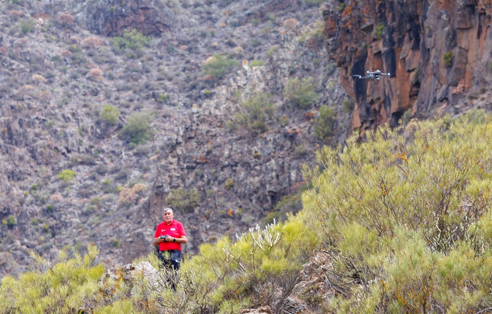 Emergency workers using a drone look for Jay in the mountains near Masca