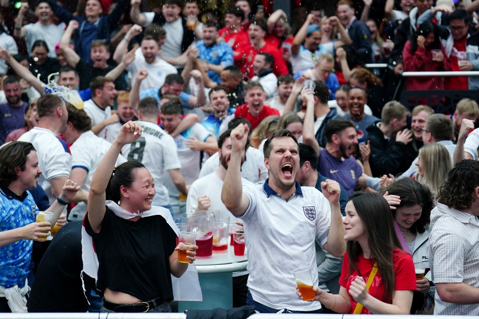 England fans celebrate after Bellingham scores at the 4theFans Greenwich fan park