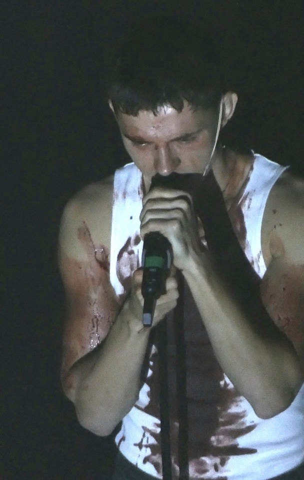 Tom seen covered in blood during a Romeo performance