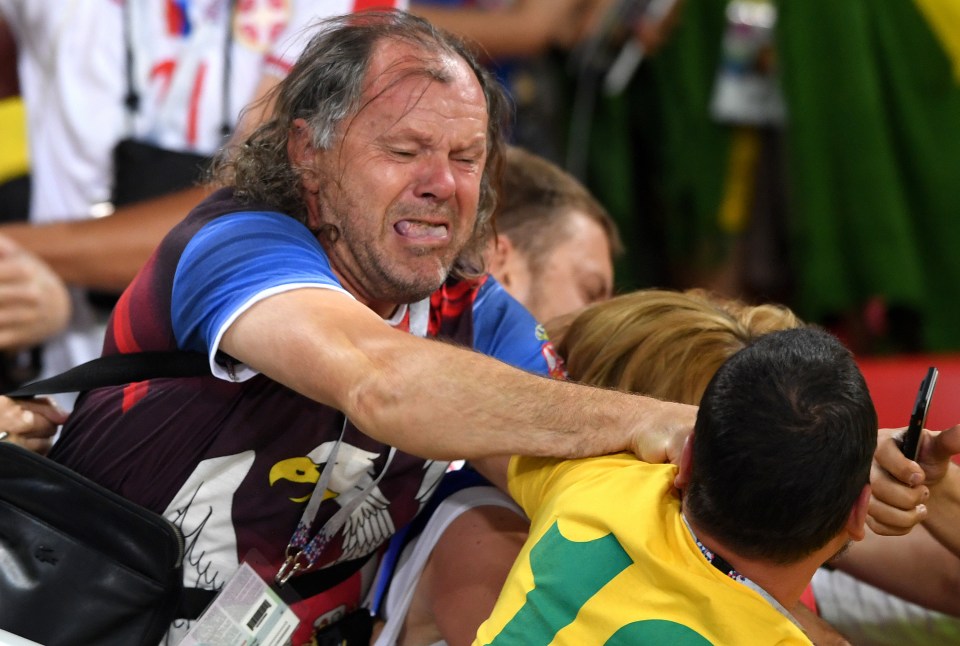 One Serbia fan throws a punch at a Brazilian rival back in 2018