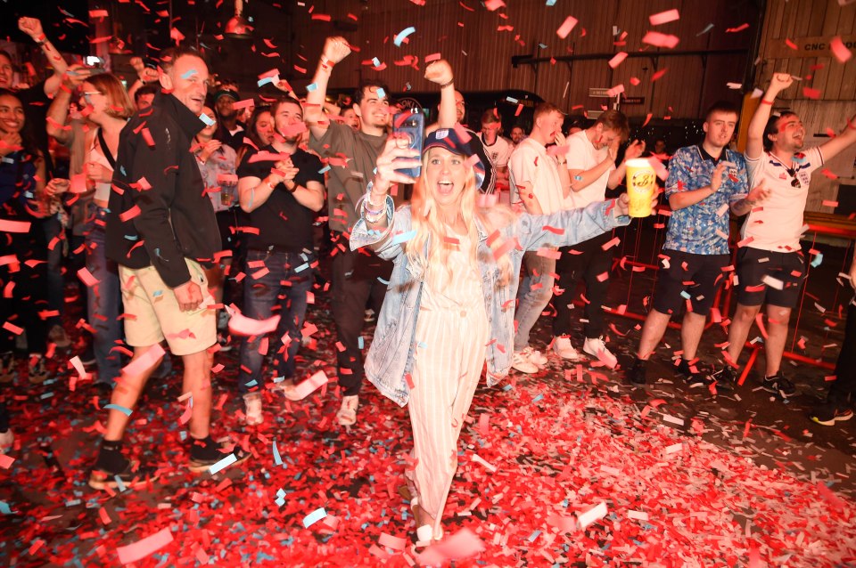 Fans celebrate England's first goal at Diecast bar in Manchester