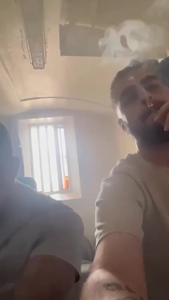 The two prisoners are seen on camera at the same time