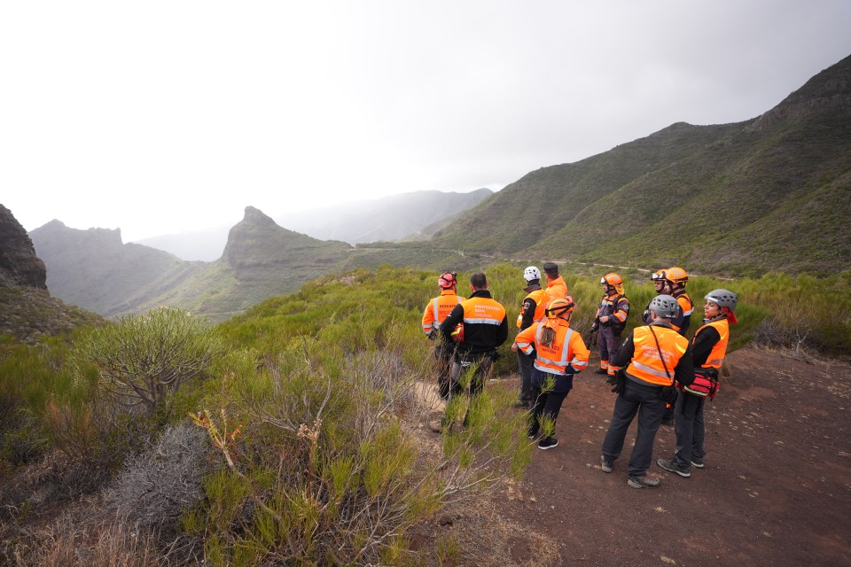 a group of people wearing orange vests with the word rescue on them