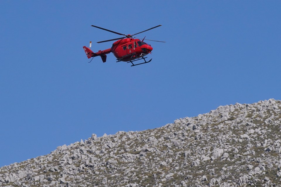 A helicopter flying over the hills close to Pedi as part of the rescue mission