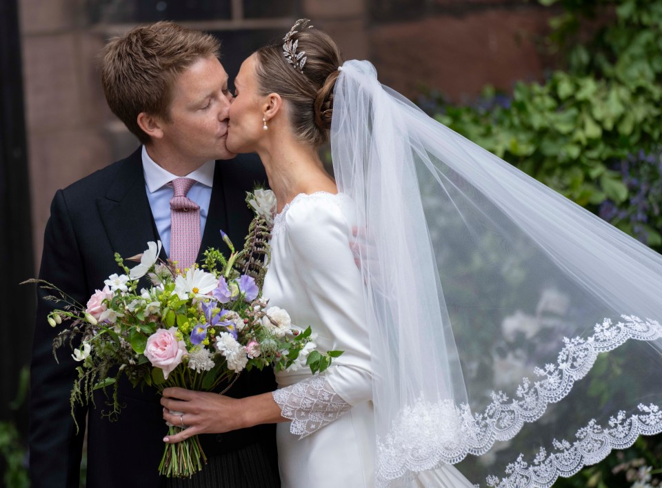 The happy couple shared a kiss after the were married