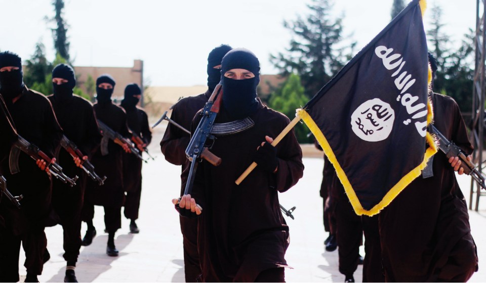 Masked ISIS terrorists brandish the death cult’s flag