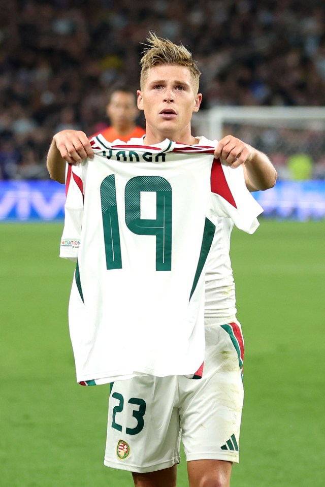 Kevin Csoboth celebrates with his team-mate's shirt after Hungary's late winner