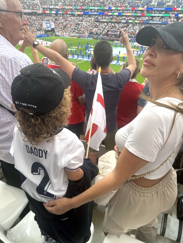 Lauryn Goodman watches Kyle Walker play for England with her son Kairo