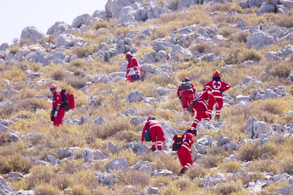 Firefighters combing the mountain side after the search shifted to the rocky outcrops on Saturday