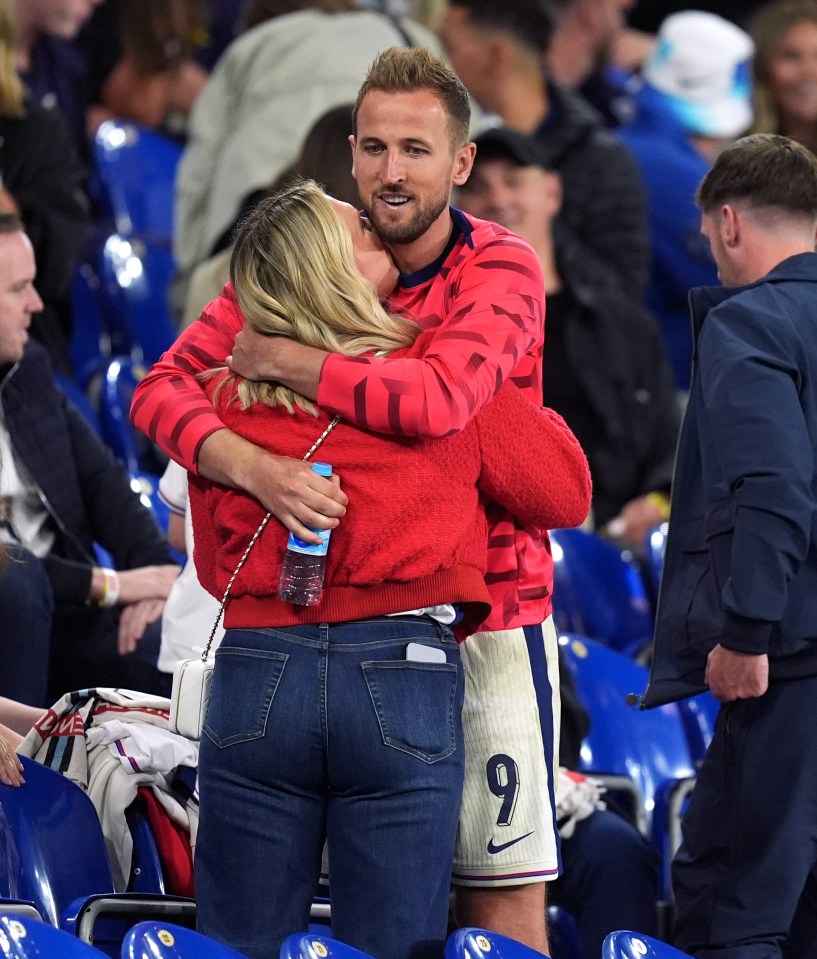 The couple shared a cuddle after a tough night in Germany