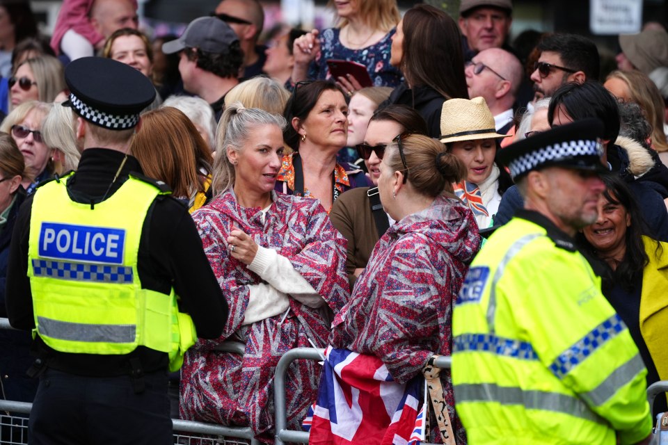 Patriotic Brits lined the street to try to get a peek at the pair