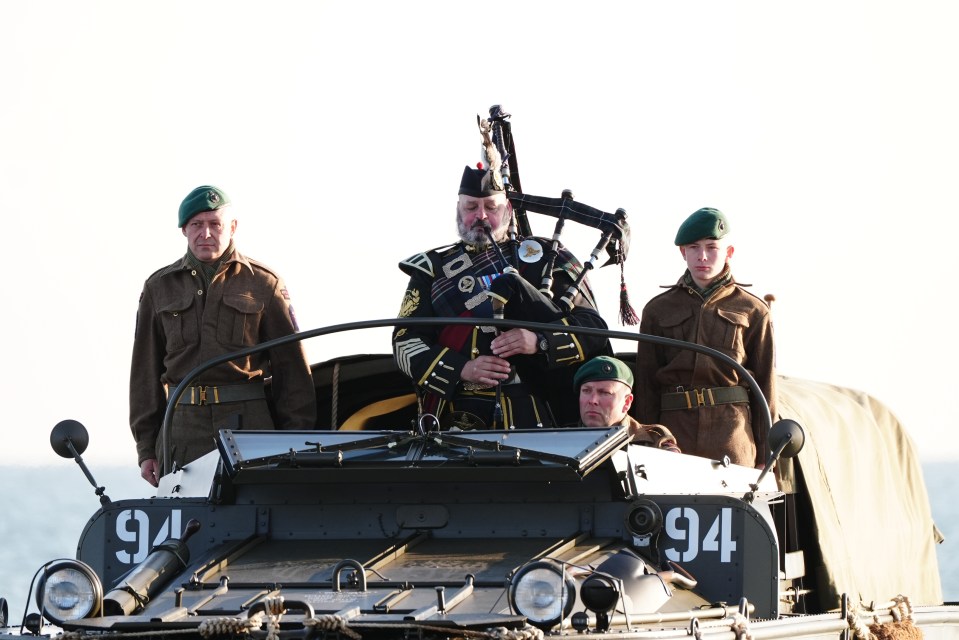 A military piper played a dawn lament on Gold Beach in Arromanches this morning