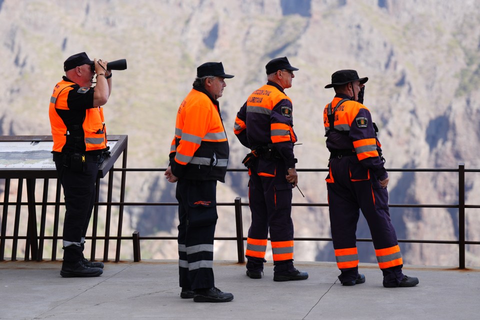 Mountain rescue survey the ravine in Tenerife where they are searching for Jay