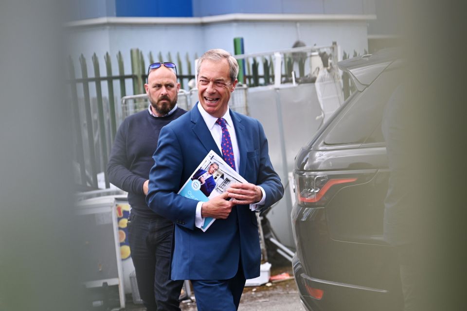 Nigel Farage arrives at a community centre in Gurnos, South Wales