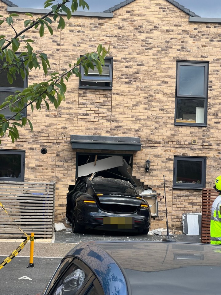 Picture of the crashed Porsche after it rammed into the newly-built home