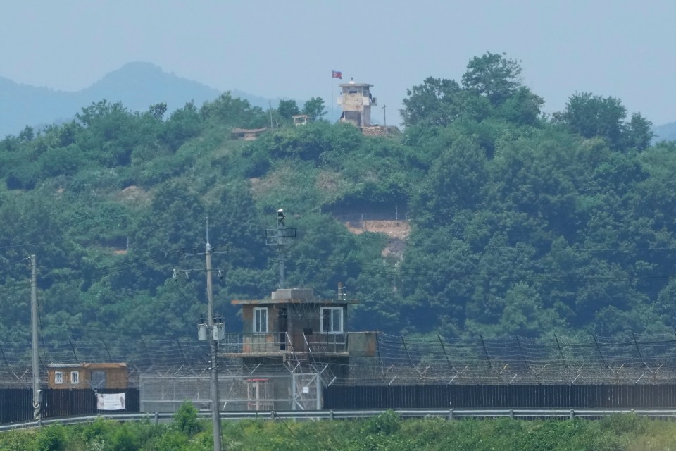 a tower with a red flag on top of it