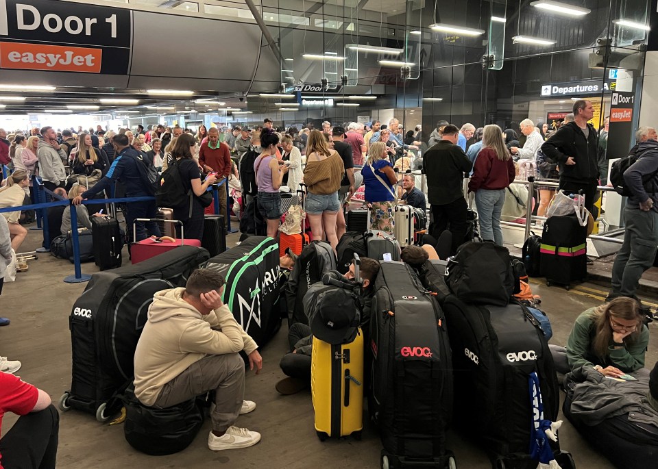 Passengers queue outside Terminal 1